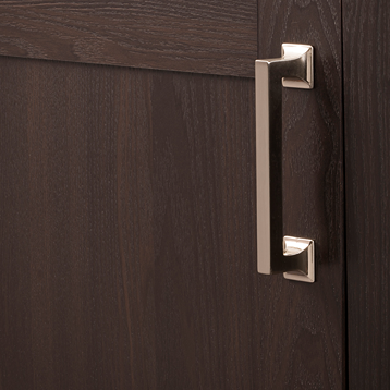 Satin nickel cabinet pull mounted on dark wood door showcasing sleek, modern hardware for furniture and home improvement
