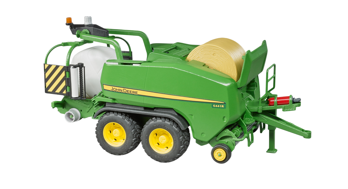 Green and yellow toy wrapping chamber baler with white bale from Bruder Toys in Vehicles & Remote Controlled Toys collection