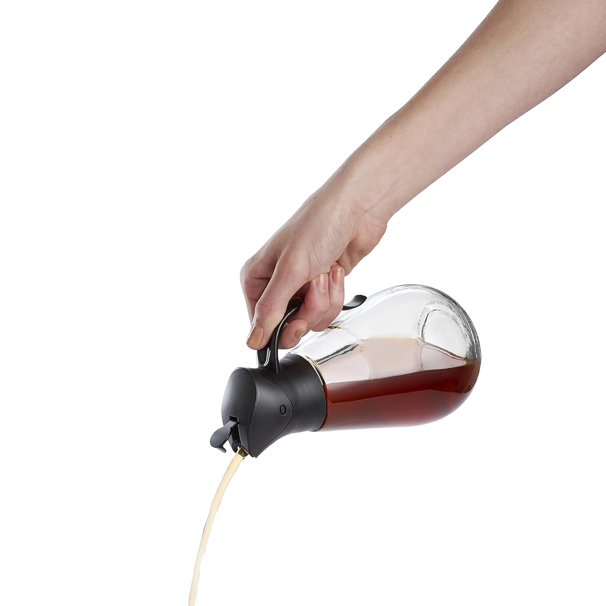 Hand holding clear glass syrup dispenser with black lid pouring syrup in Kitchen Storage and Food Storage collections