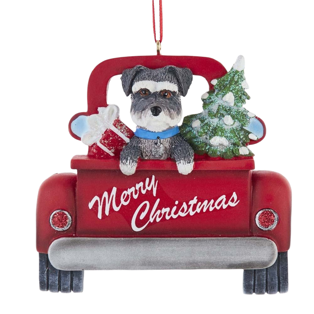 Red resin ornament showing Schnauzer dog in bed of red truck with Christmas tree and gifts under $50