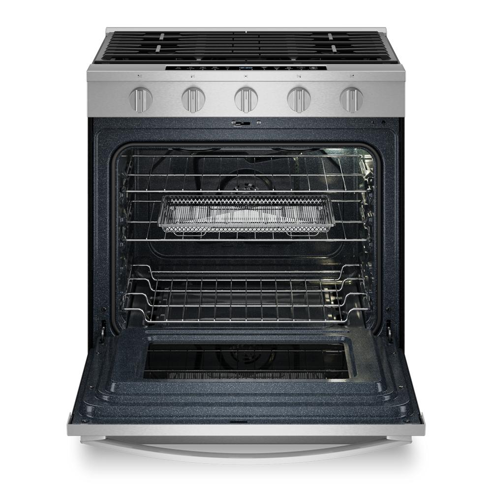 Front view of stainless steel 30-inch slide-in gas range with open oven door and multiple racks inside for kitchen appliances use
