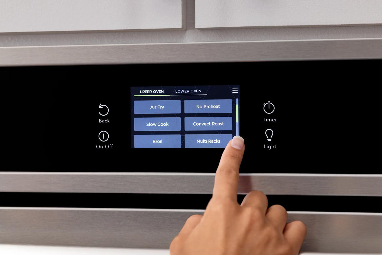 Close-up of touch screen control panel on stainless steel double wall oven in kitchen appliances collection