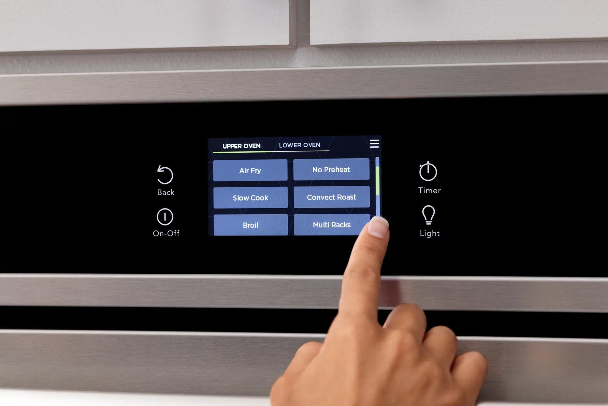 Close-up of touch screen control panel on stainless steel double wall oven in kitchen appliances collection