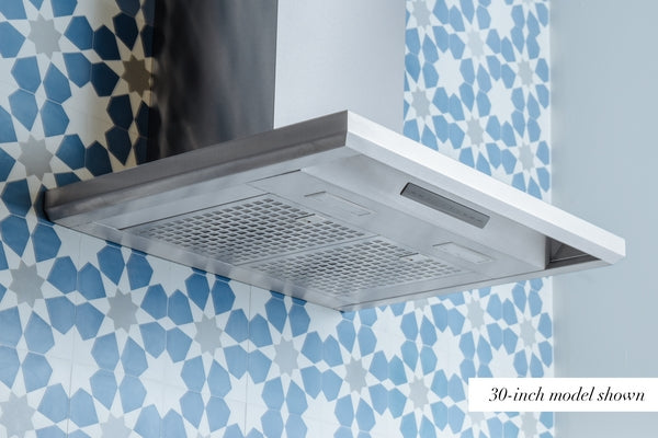 underside view of stainless steel pyramid chimney wall range hood with modern perforated filters and venting panel