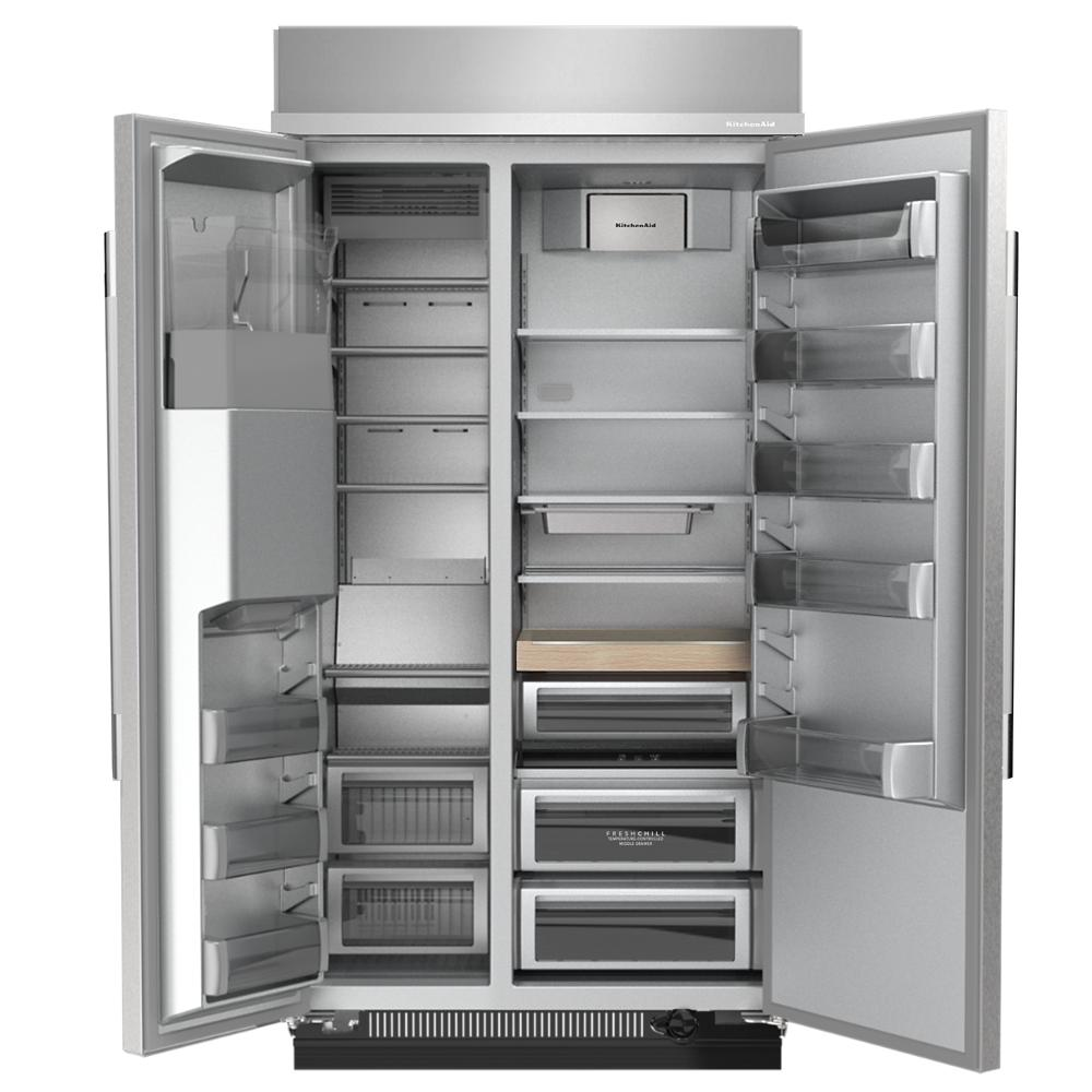 Open stainless steel built-in side-by-side refrigerator displaying adjustable shelves, drawers, and door bins in a kitchen setting