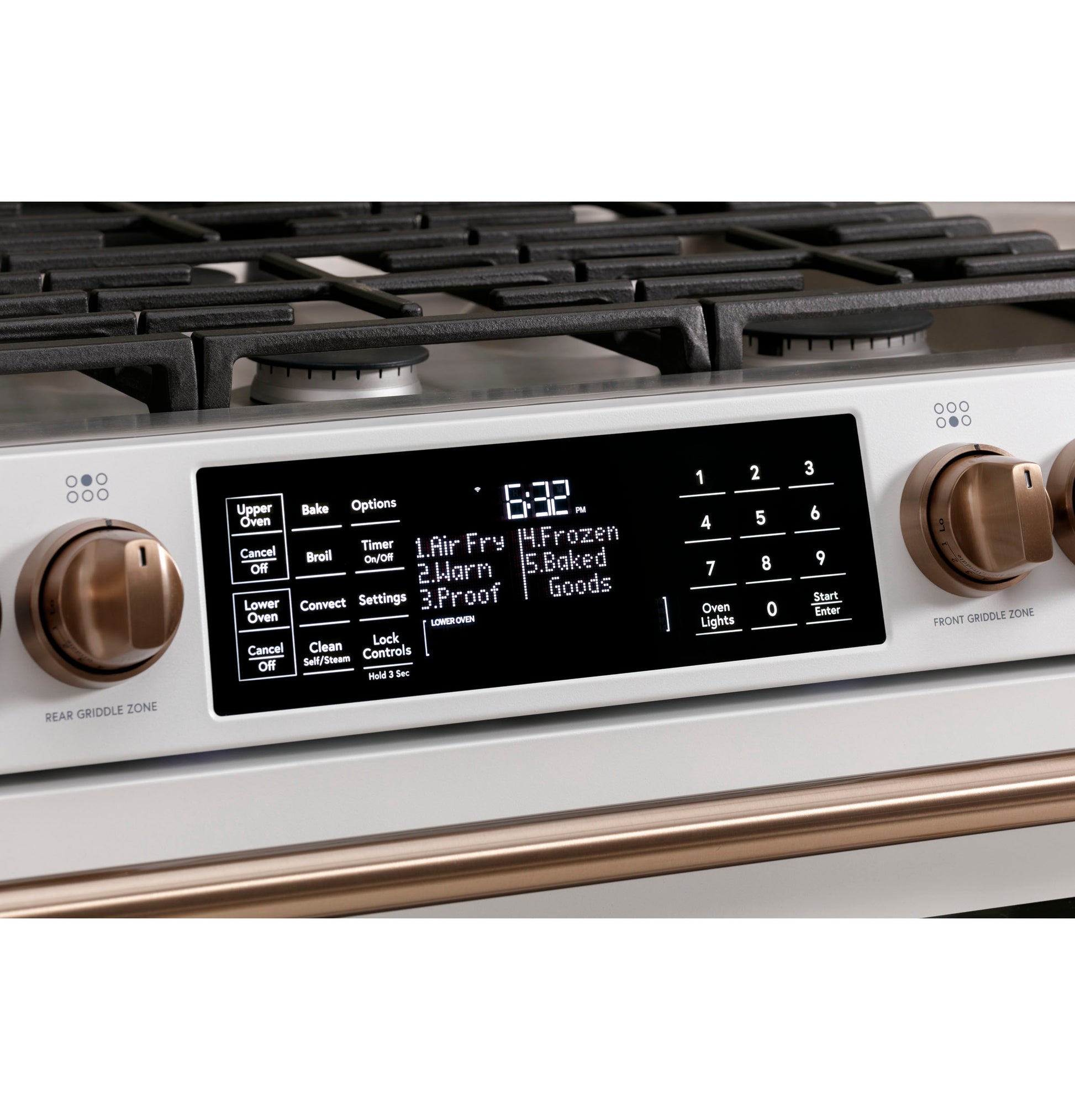 Close-up of control panel on white smart gas double-oven range with bronze knobs from Ranges and Appliances collections