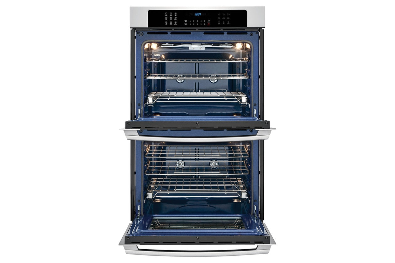 Open electric double wall oven with illuminated blue interior and multiple Luxury-Glide® racks for kitchen appliances