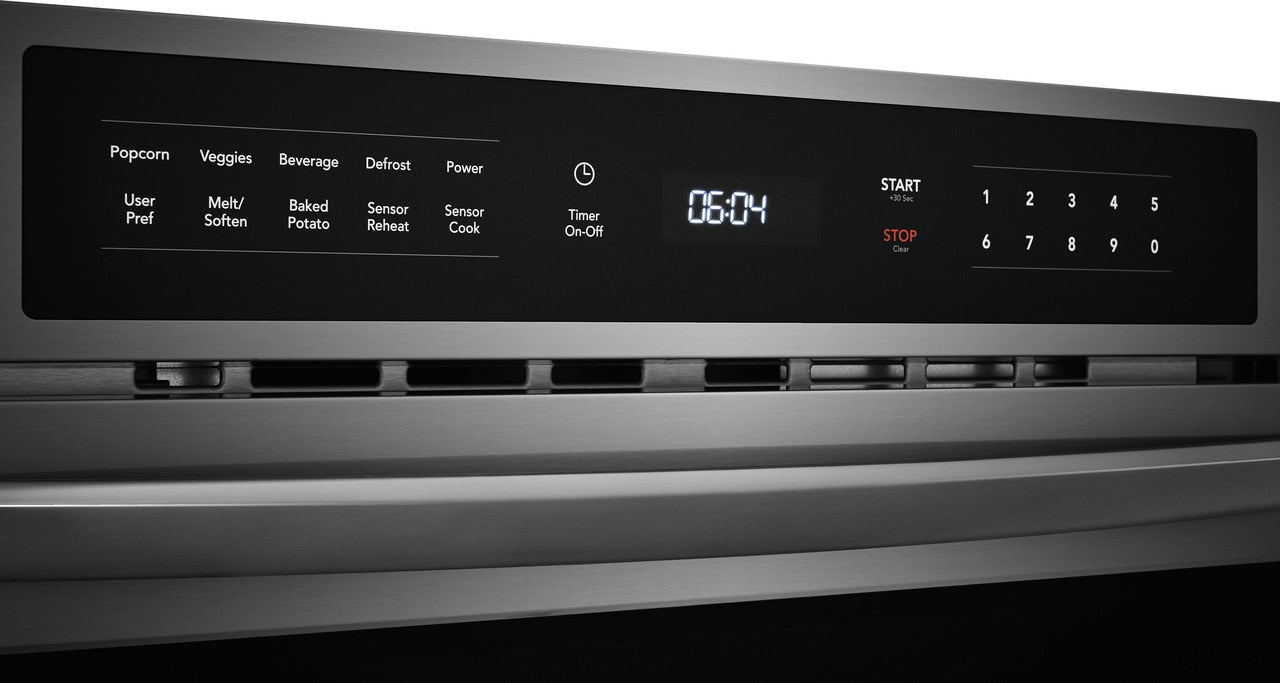 Close-up of black digital control panel with timer and touch buttons on stainless steel built-in microwave in appliances collection