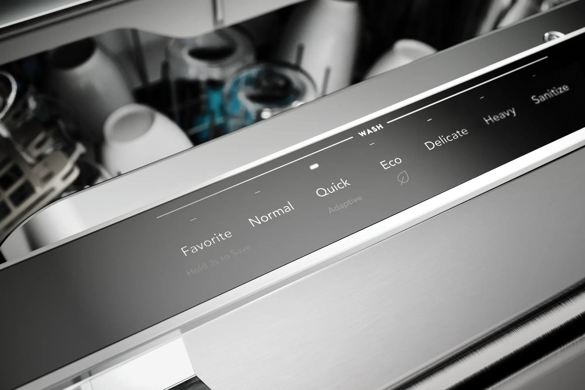 Close-up of stainless steel dishwasher control panel showing cycle options for kitchen appliances collection