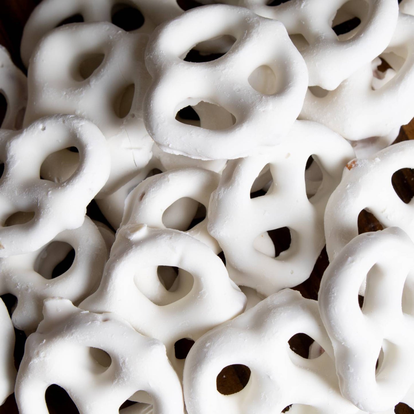 Close-up of white chocolate coated mini pretzels from Chips & Snacks and Food & Beverage under $50 collections