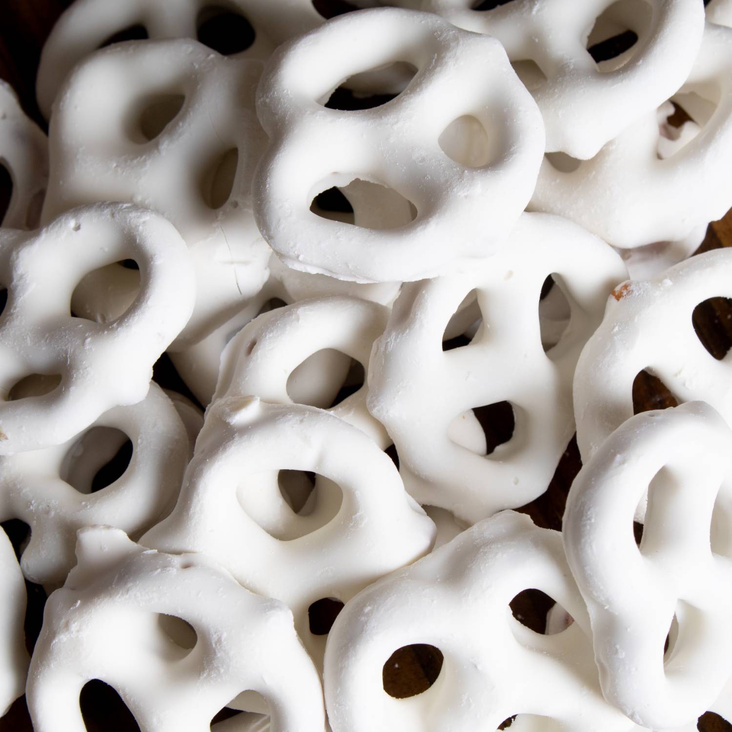 Close-up of white chocolate coated mini pretzels from Chips & Snacks and Food & Beverage under $50 collections