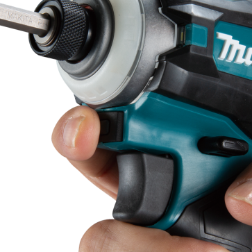 Close-up of hand gripping teal and black cordless impact driver for home improvement tasks