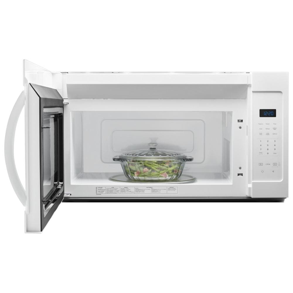 White microwave with electronic touch controls and digital timer display cooking vegetables in glass dish from kitchen appliances collection