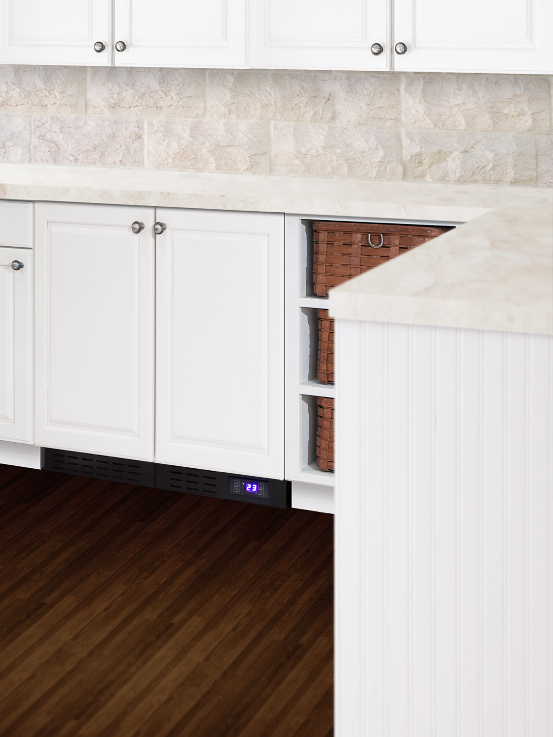 Built-in undercounter all-refrigerator with front vent and digital temperature display in white kitchen cabinetry from Appliances collection