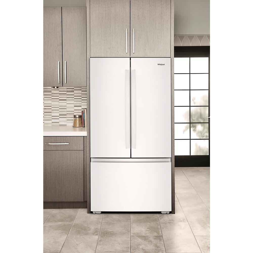 White 36-inch wide 3-door French door refrigerator with bottom freezer integrated into modern kitchen space for home improvement.