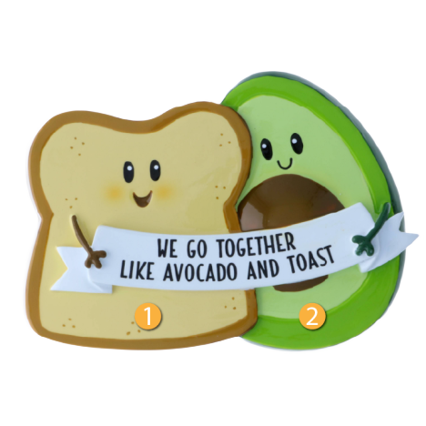 Smiling avocado and toast ornament holding banner with "We go together like avocado and toast" for Christmas decor under $50