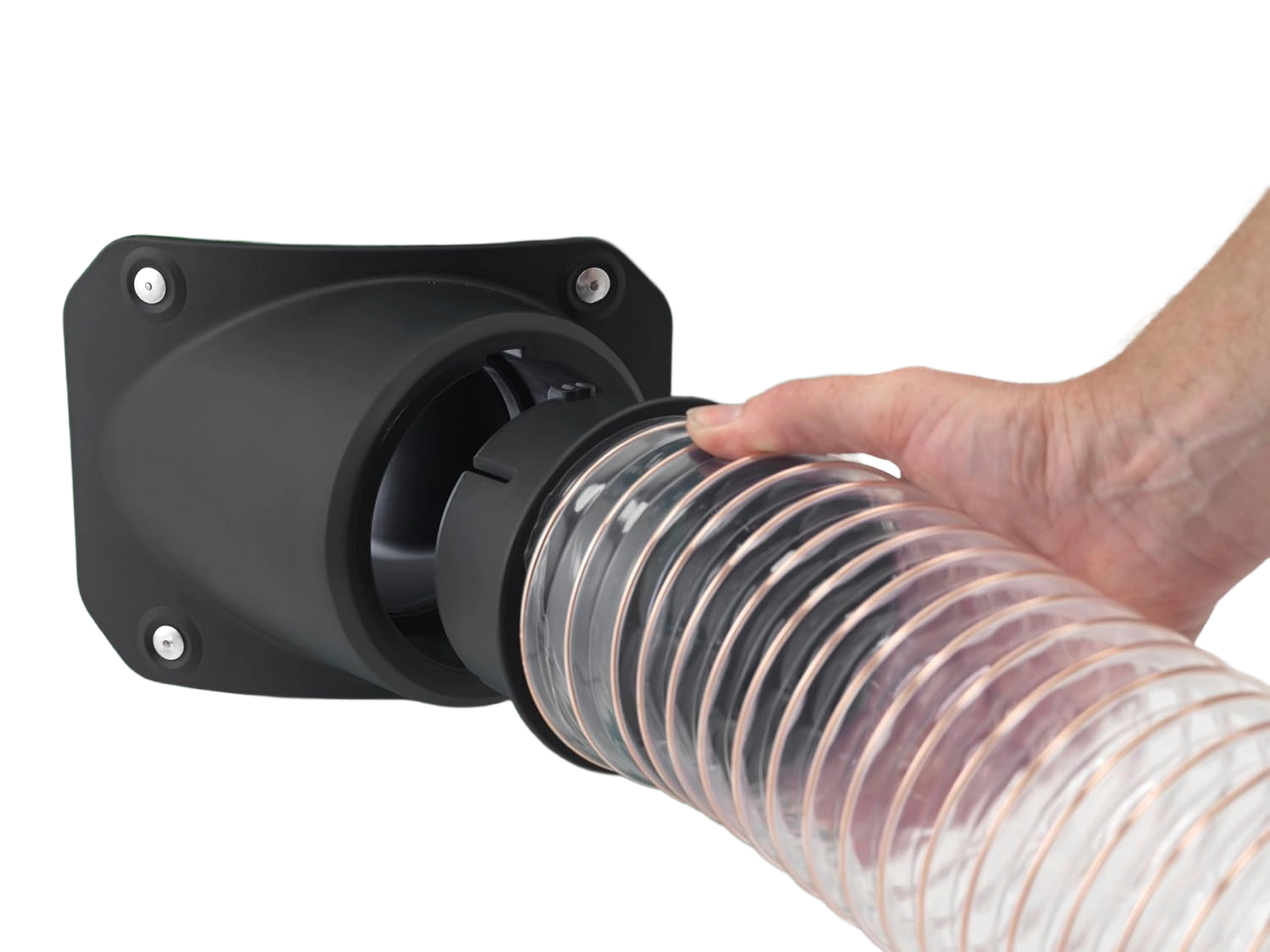 Hand connecting clear flexible hose with metal coil reinforcement to a black dust extraction inlet port, part of woodworking tools and dust collection equipment.