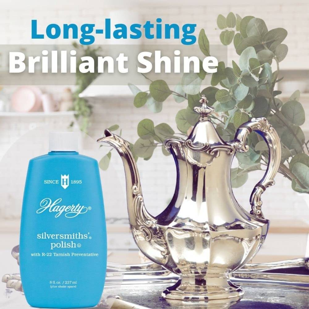 Blue 8 oz bottle of silver polish lotion next to polished silver teapot for cleaning supplies under $50 collection