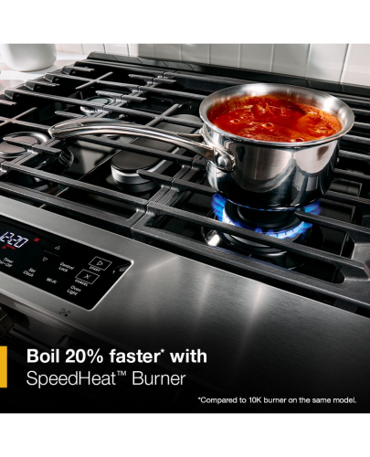 Stainless steel gas smart range with SpeedHeat burner boiling red sauce in pot, shown in kitchen appliance setting