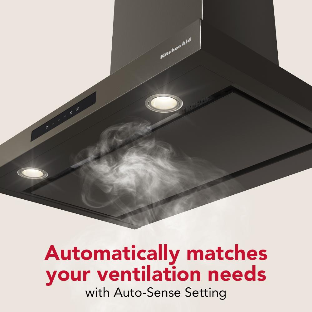 Matte black wall-mount canopy hood with Auto-Sense ventilation and LED lights from KitchenAid appliances collection