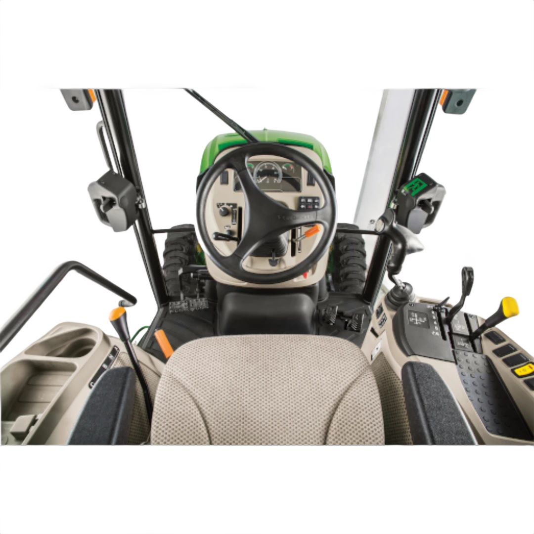 Operator's seat view inside the John Deere 4052R Compact Tractor featuring steering wheel, control levers, and instrument panel in Outdoor Power Equipment at Hartville Hardware.