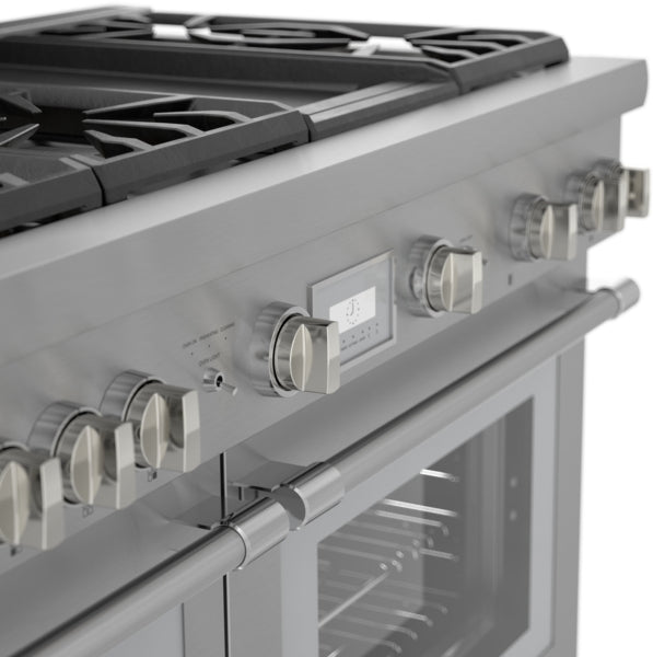 Close-up of stainless steel dual fuel range with control knobs and digital display in modern kitchen setting