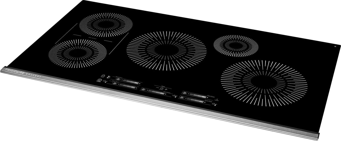 Sleek black 36-inch induction cooktop with five circular heating zones and touch controls in kitchen appliance collection