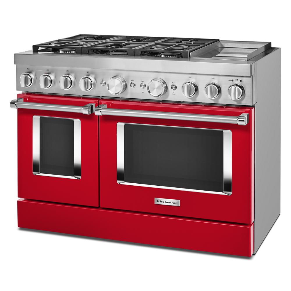 Red commercial-style dual fuel range with six burners, electric double ovens, griddle, and stainless steel accents in KitchenAid appliances collection