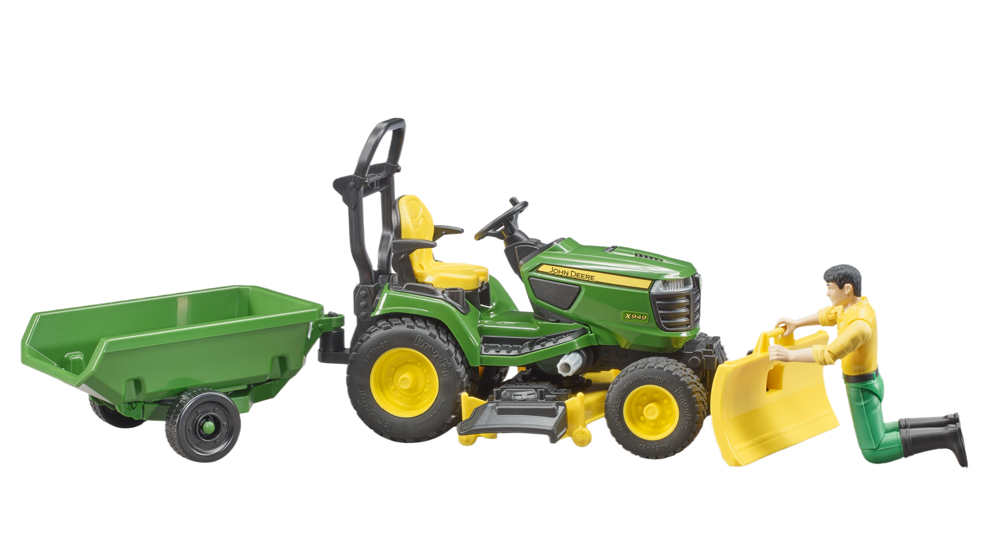 Green and yellow John Deere lawn tractor toy with trailer and driver figure, part of outdoor power equipment and lawn mower collections