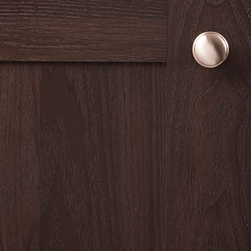 Satin nickel knob with smooth rounded Williamsburg design mounted on dark wood cabinet for home improvement projects