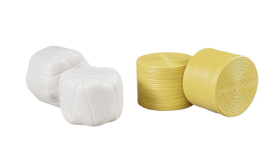 Set of four plastic round and square bale models in white and yellow for farm equipment display or toy collection