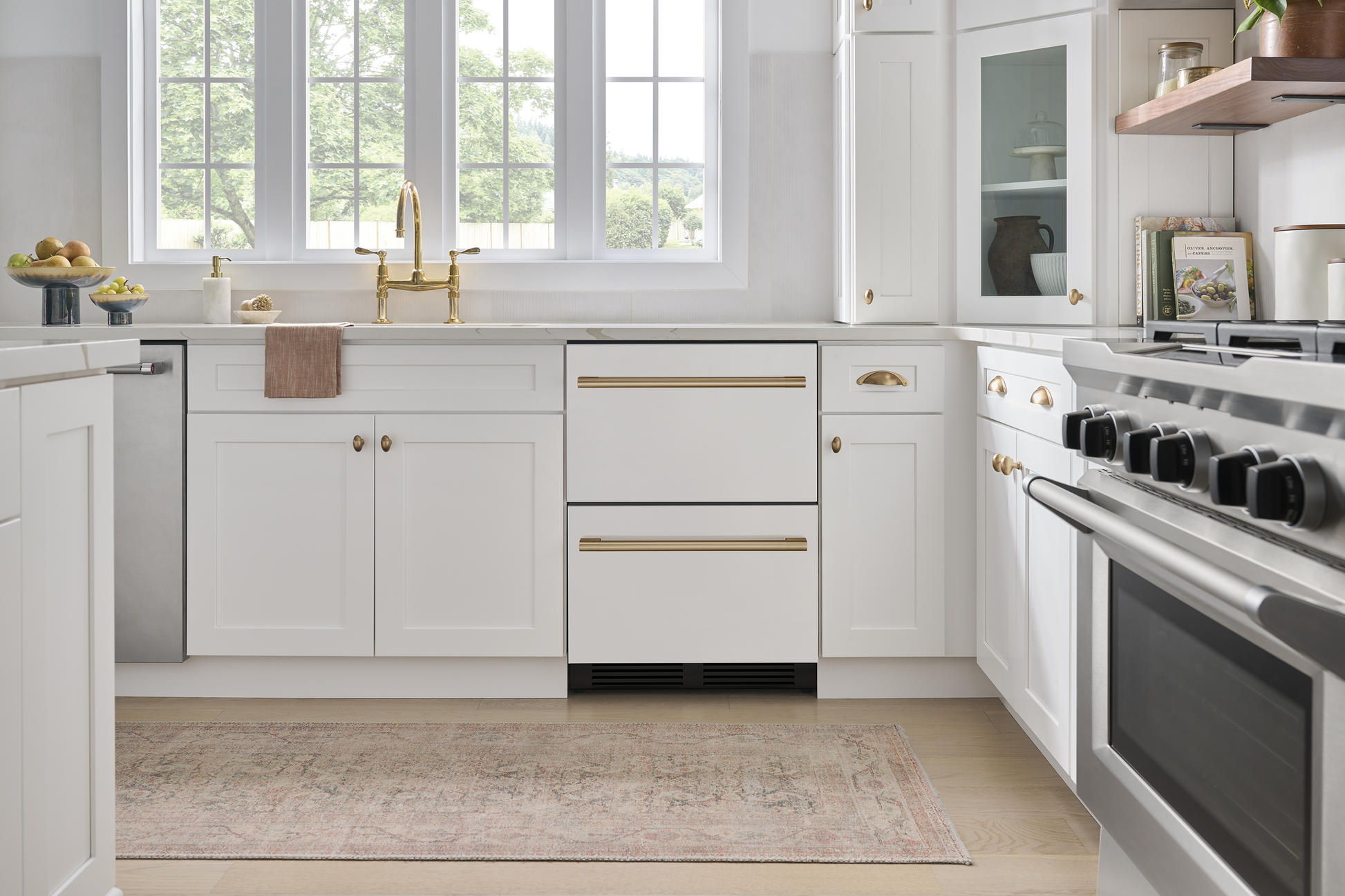 Under-counter 24" panel ready dual zone refrigerator drawers integrated in white kitchen cabinetry from kitchen appliances collection