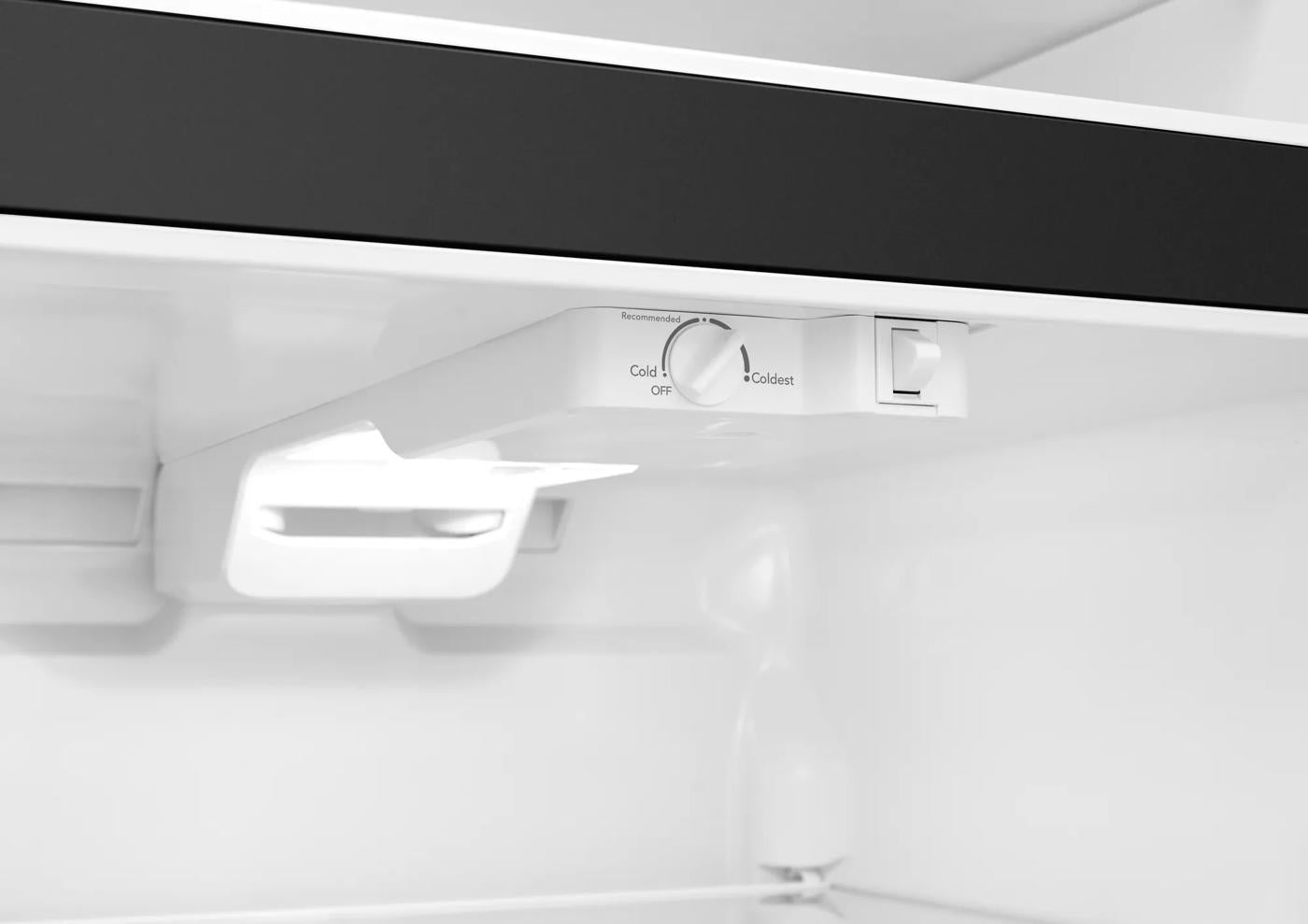 interior view of top freezer compartment with temperature control dial and LED light in appliances collection