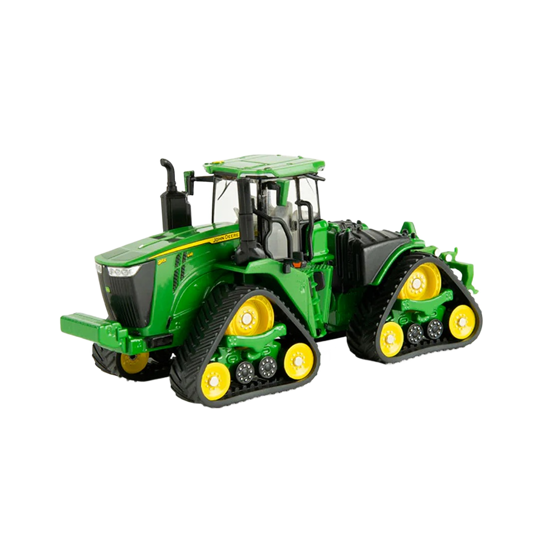 Green and yellow tracked farm tractor model with detailed cabin and robust treaded wheels for home improvement display