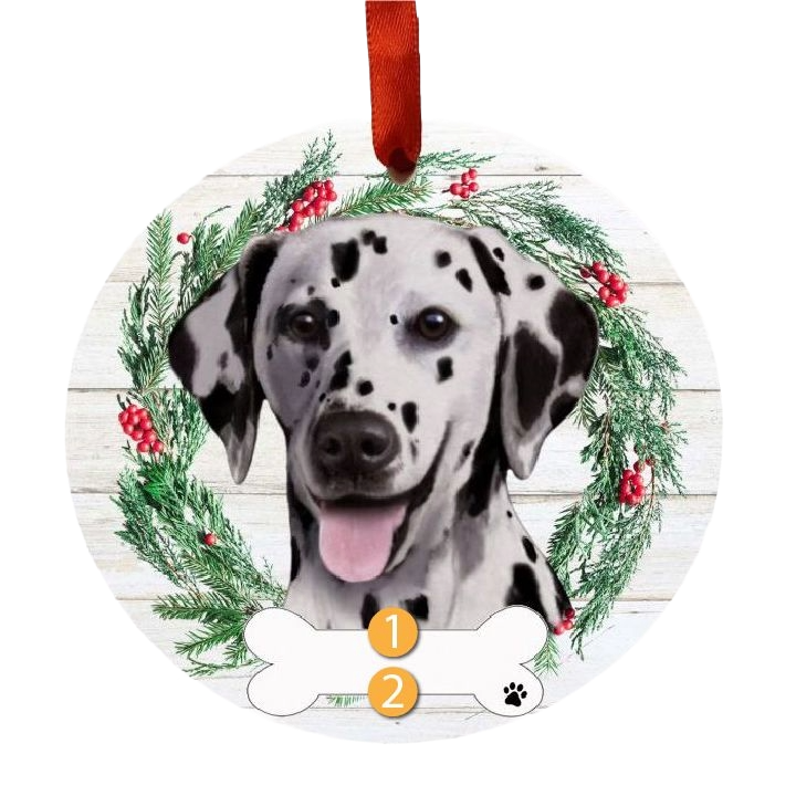 Round Christmas ornament featuring a Dalmatian face inside a festive wreath with red berries and pine branches