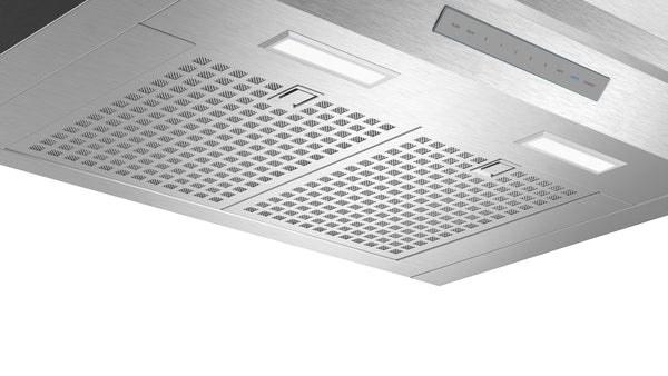 Under-cabinet stainless steel custom insert hood with integrated ventilation grates and LED lighting for range hood collections