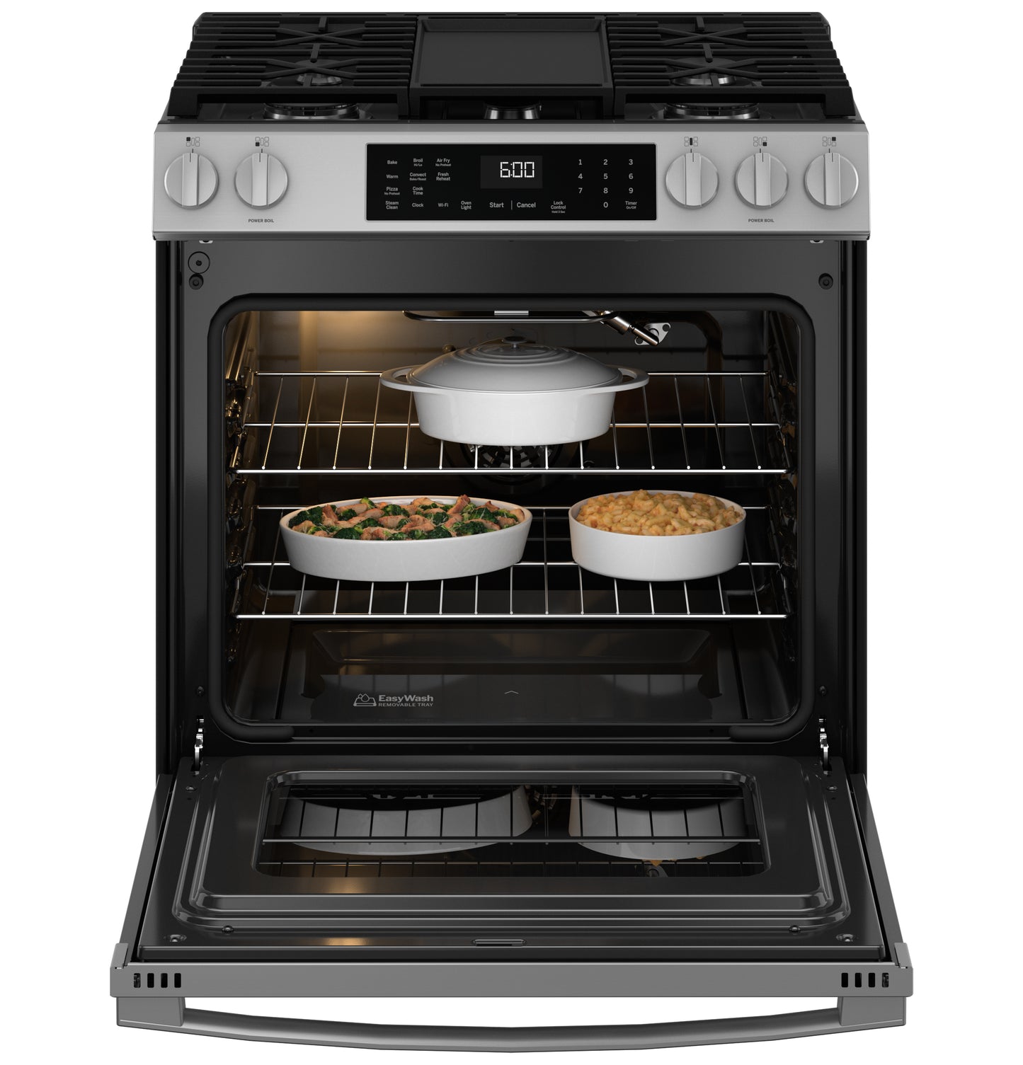 Open stainless steel gas range oven with cookware inside and EasyWash™ tray on the door in kitchen appliances collection