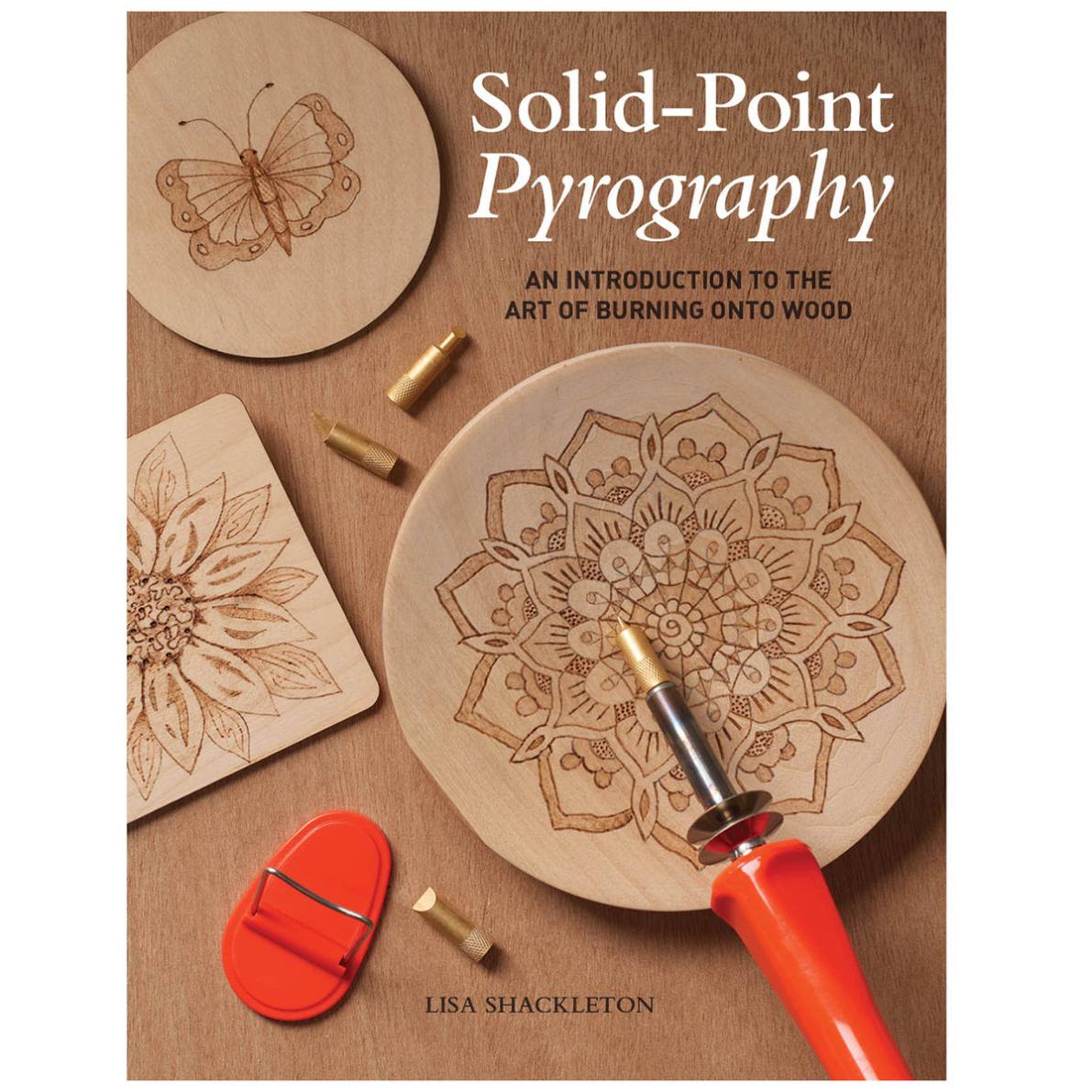 Book cover showing woodburning tools and detailed pyrography designs of a butterfly and floral patterns on wooden plaques