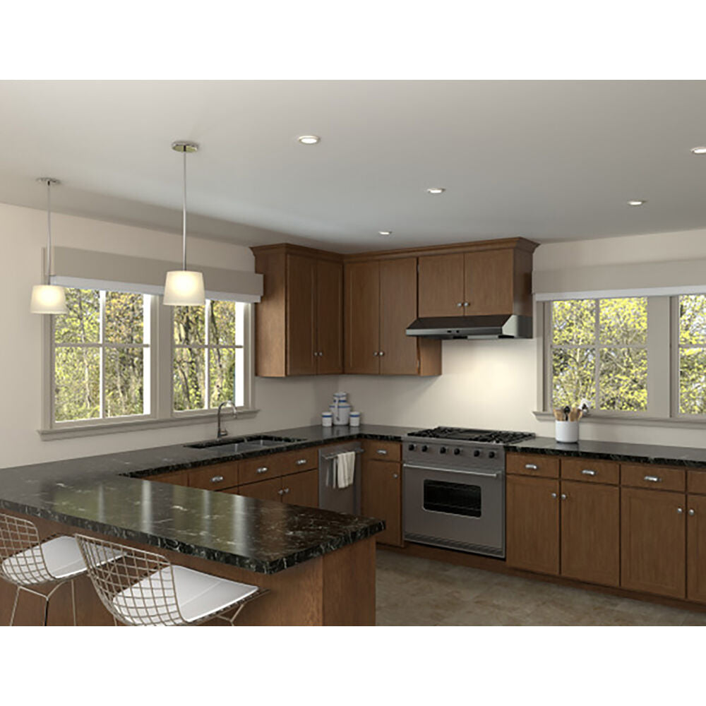 Modern kitchen with wood cabinets, granite countertops, and under cabinet range hood in a home improvement setting
