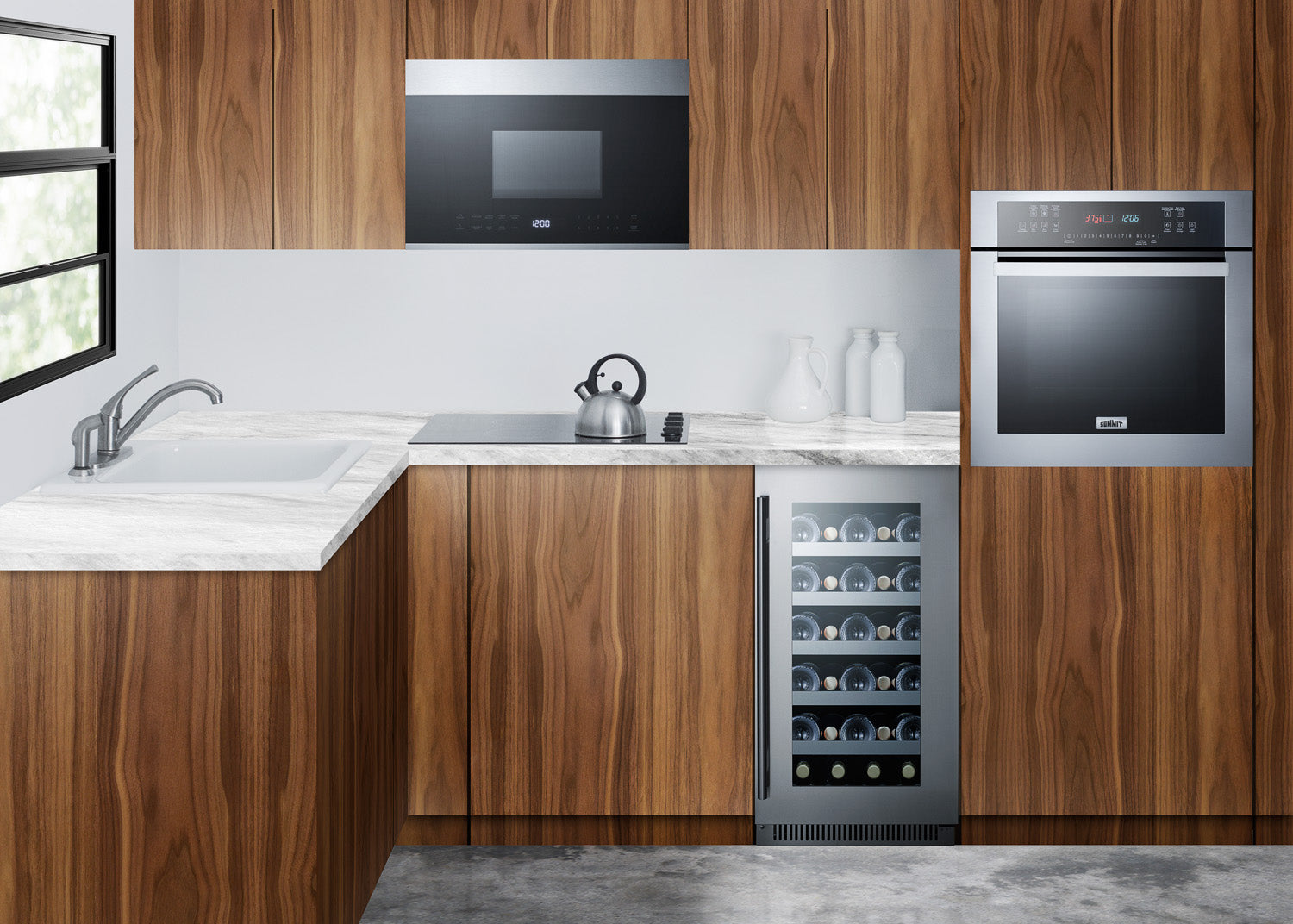 Built-in microwave and oven with stainless steel finish in modern kitchen with wood cabinets and marble countertops