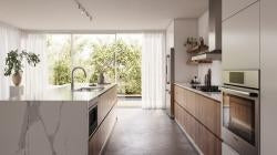 Built-in stainless steel drawer microwave in modern kitchen with natural light and contemporary cabinetry design