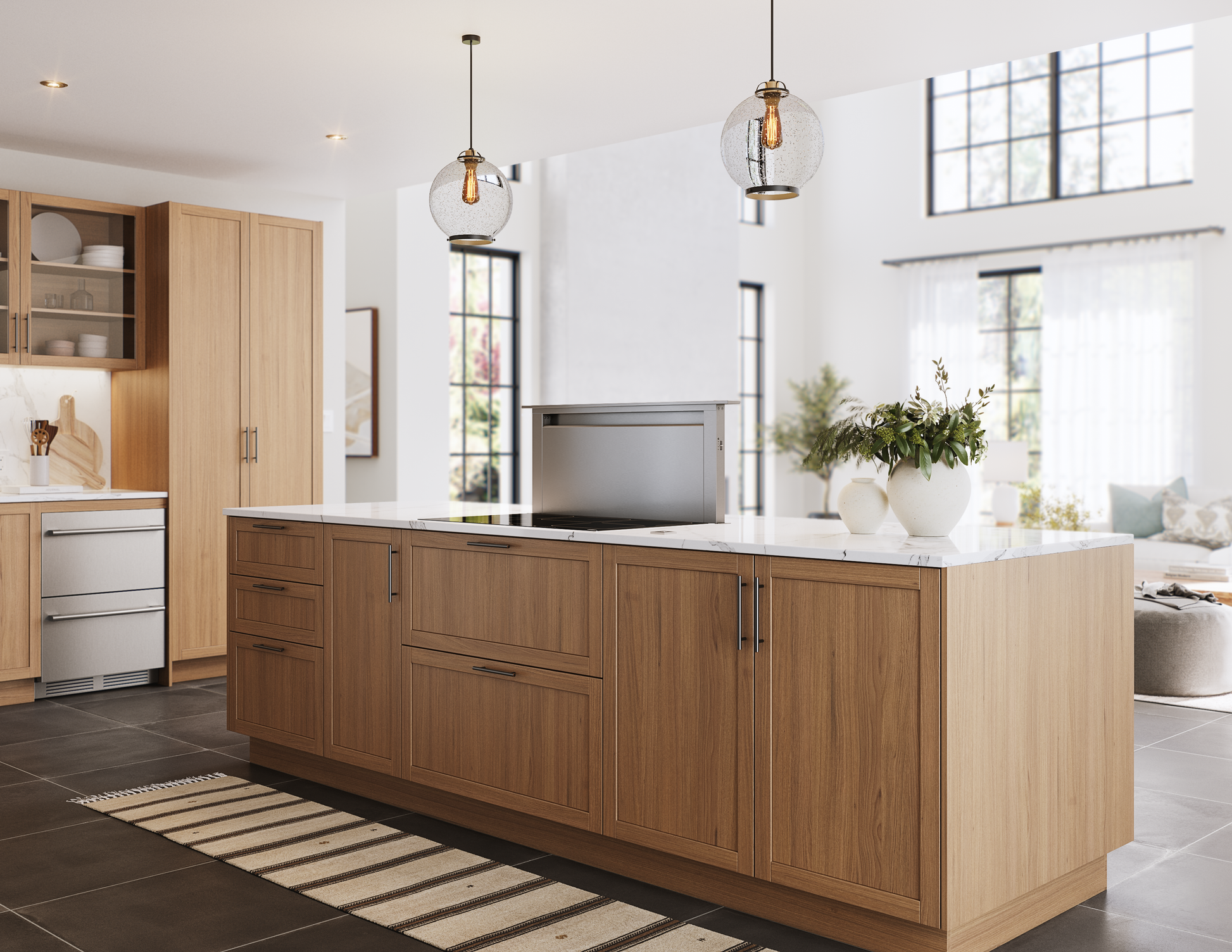Modern kitchen island with wood cabinetry and a hidden stainless steel downdraft vent in range hoods collection