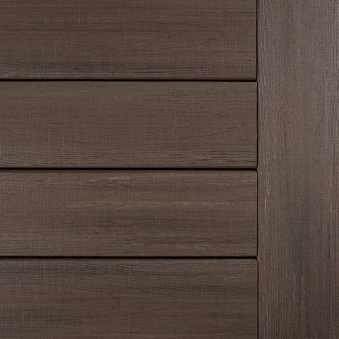 Close-up of grooved decking boards in American Walnut finish from TimberTech Landmark Collection for outdoor lumber and building projects