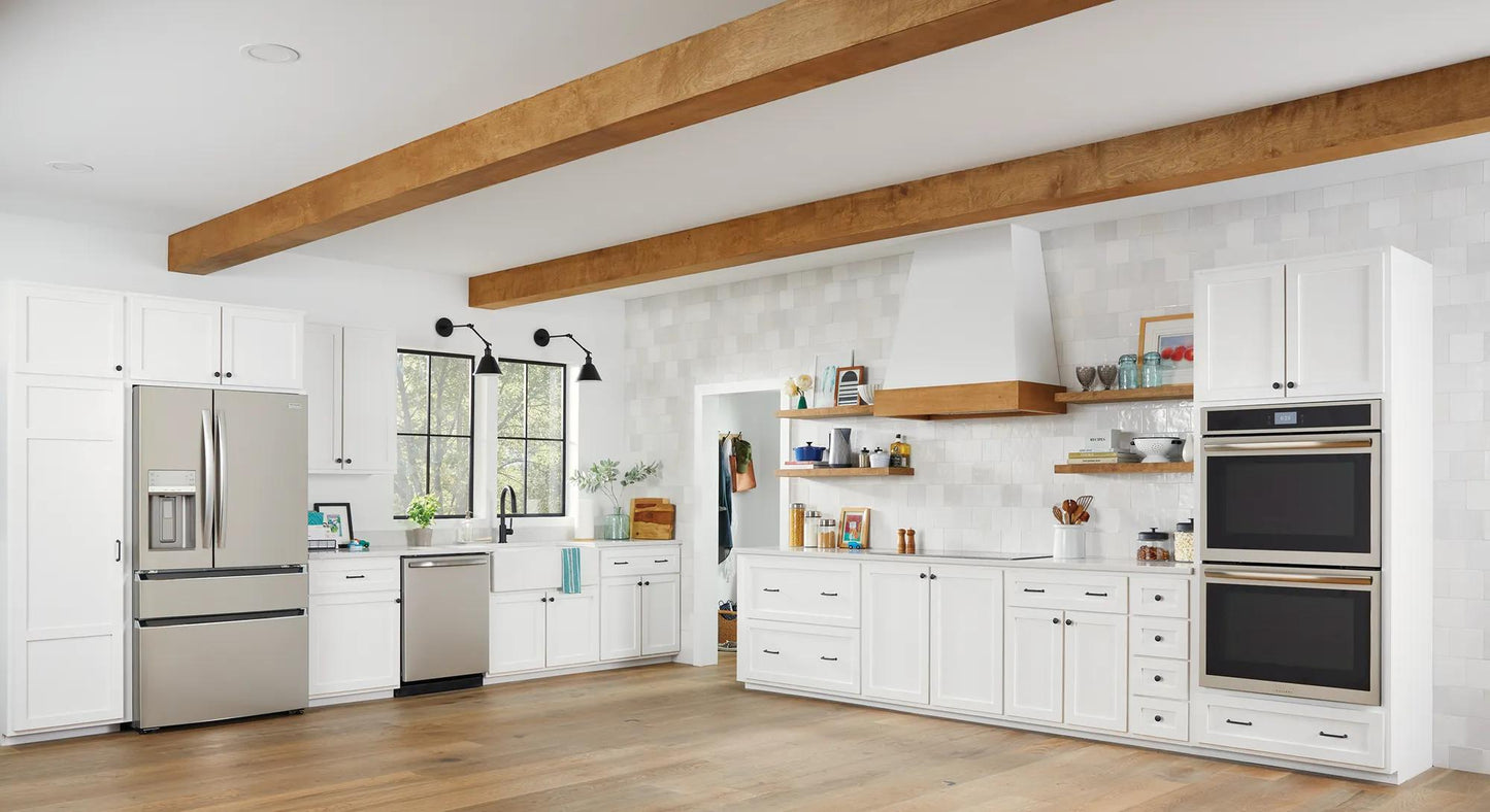 Modern kitchen featuring stainless steel built-in dishwasher amidst white cabinetry and wood ceiling beams, part of kitchen appliances collection