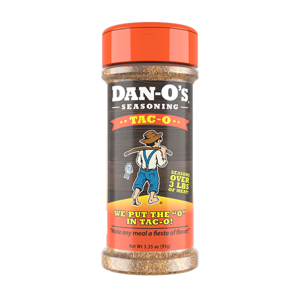 Clear plastic spice bottle with orange lid featuring rustic label and cowboy illustration for taco seasoning blend