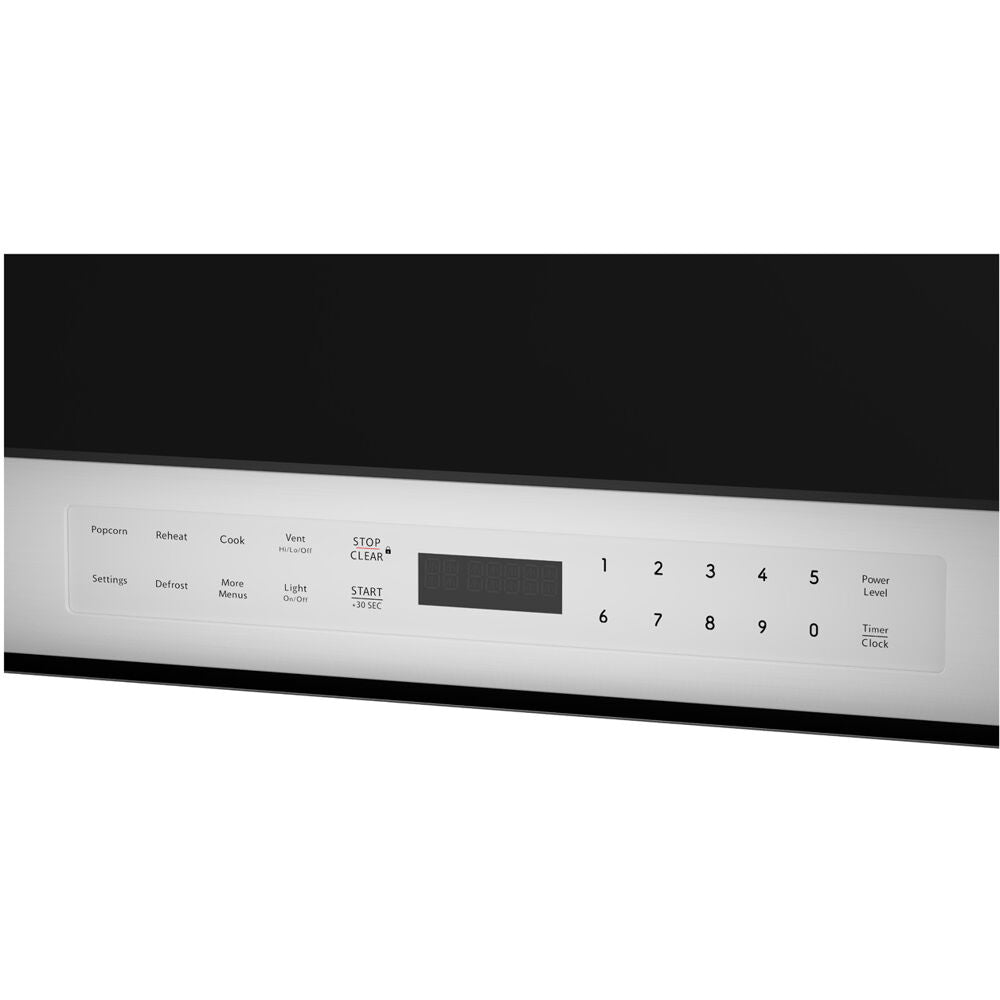 Close-up of a stainless steel microwave control panel with digital display and touch buttons for cooking functions and settings