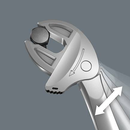 Close-up of silver self-setting spanner gripping hex bolt with arrows showing adjustable jaw movement for home improvement tasks