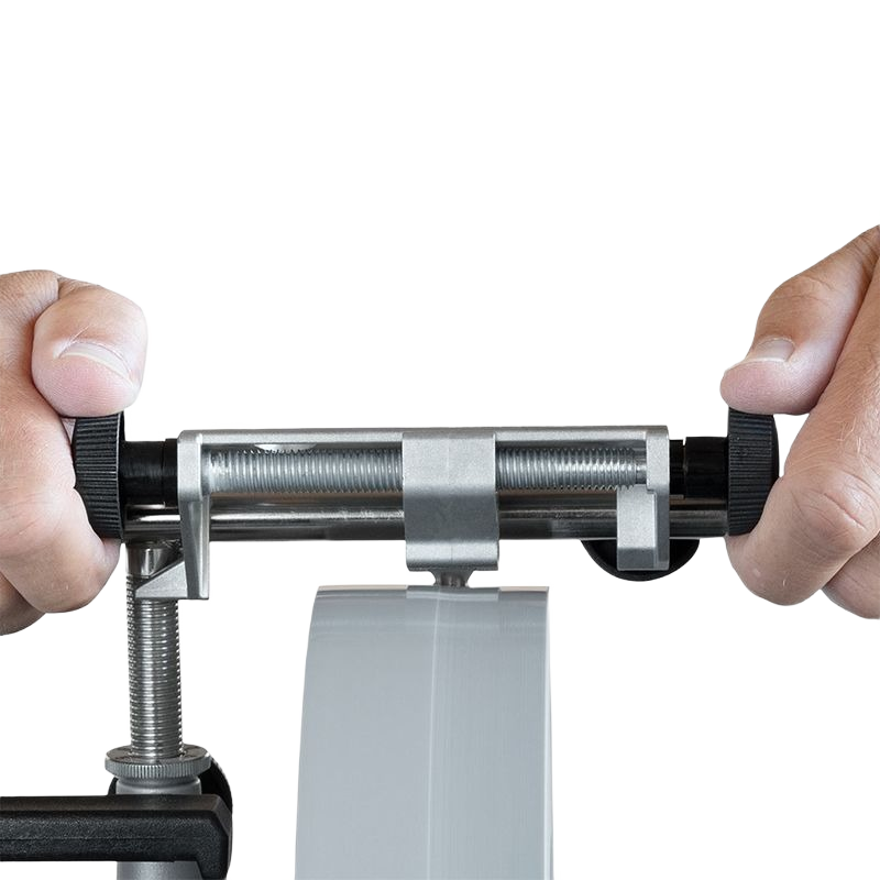 Hands adjusting silver and black diamond truing tool for grinding wheels in woodworking tool accessories collection