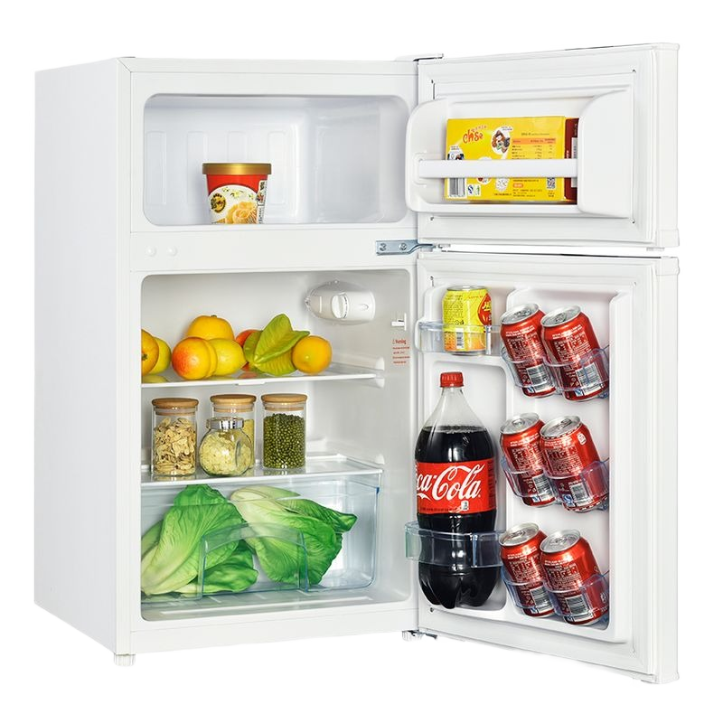 White two-door counterhigh refrigerator with freezer compartment, stocked with beverages and fresh produce for kitchen and appliance collections