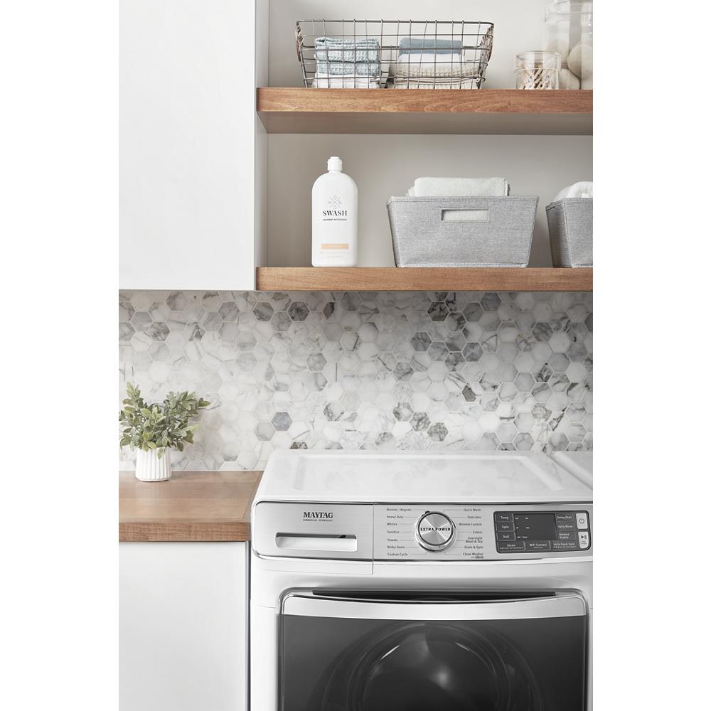 Maytag smart electric dryer with control panel and wooden shelves with laundry baskets and detergent bottle above